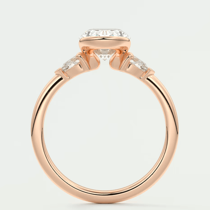 Rose gold diamond engagement ring with a cushion-cut center stone and baguette side stones.