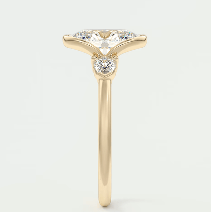 18k yellow gold engagement ring with princess cut diamond and small accent diamonds.