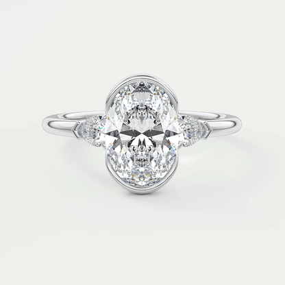 18k white gold engagement ring with an oval diamond center stone and marquise side stones.