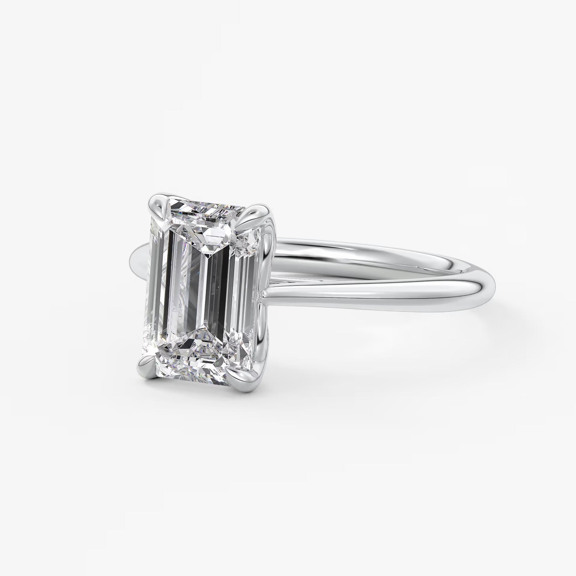 Tulip emerald cathedral engagement ring
