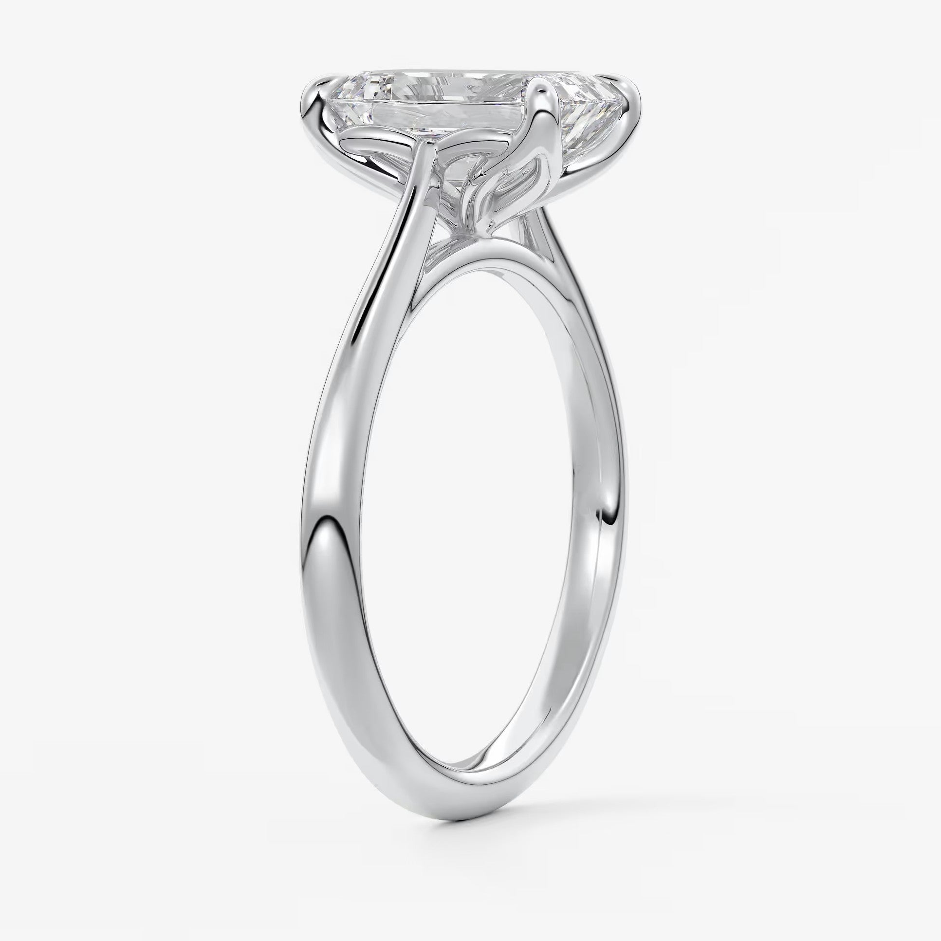 Tulip emerald cathedral engagement ring