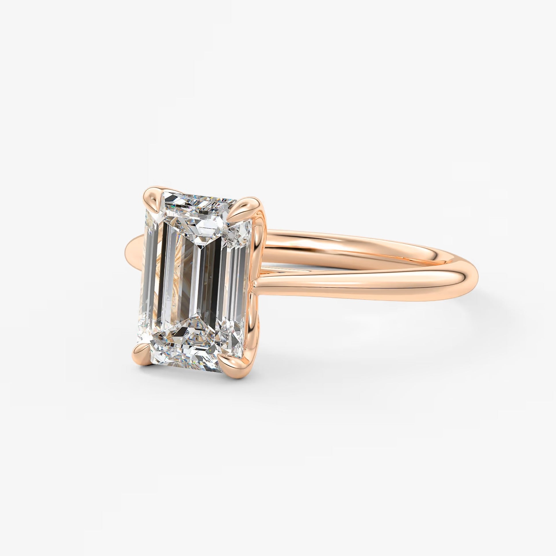 Tulip emerald cathedral engagement ring