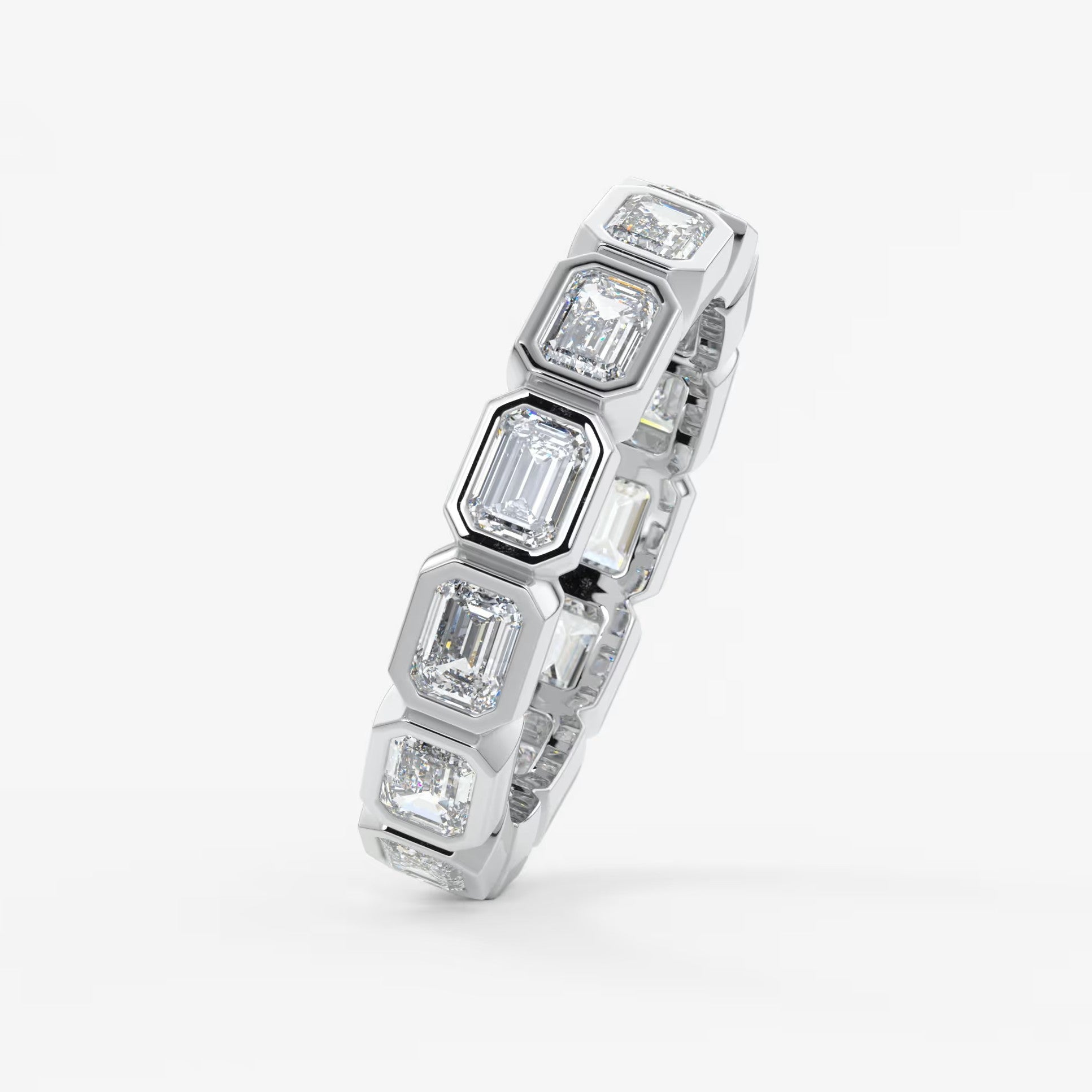 Valora east-west emerald bezel eternity band
