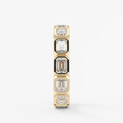 Valora east-west emerald bezel eternity band