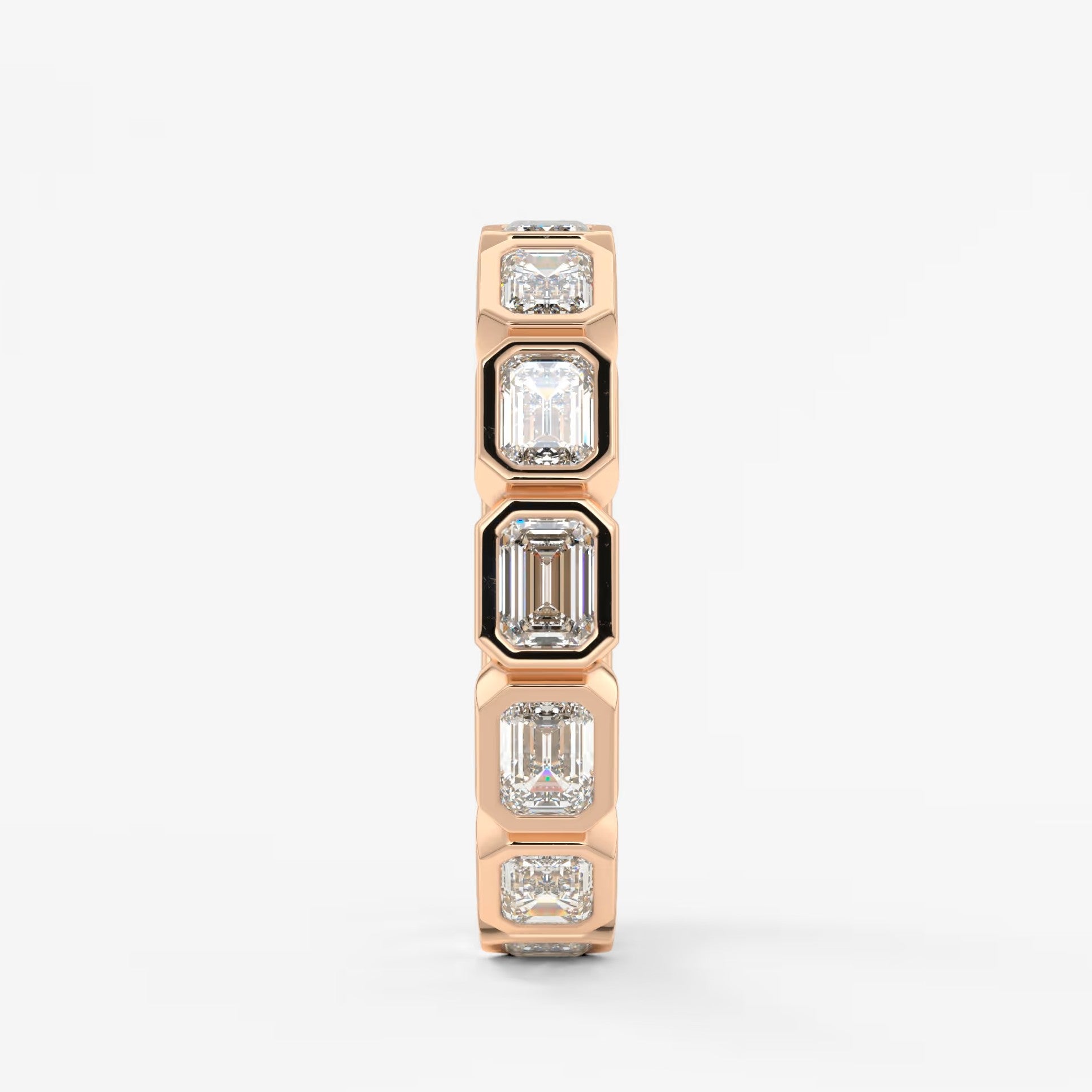 Valora east-west emerald bezel eternity band