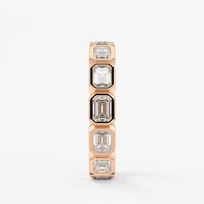 Valora east-west emerald bezel eternity band
