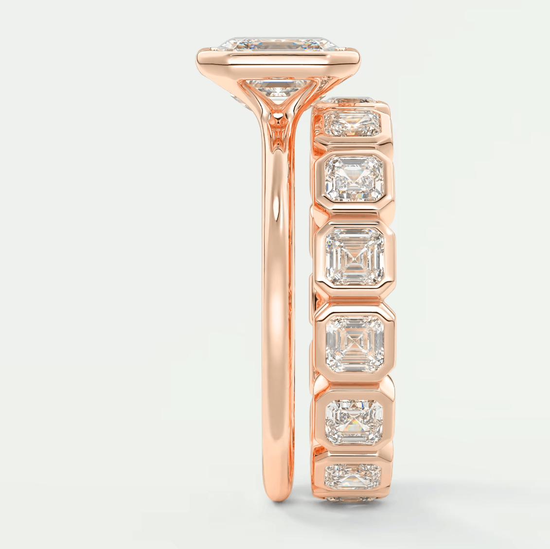 18k rose gold diamond engagement ring with a princess cut center stone and baguette side stones.