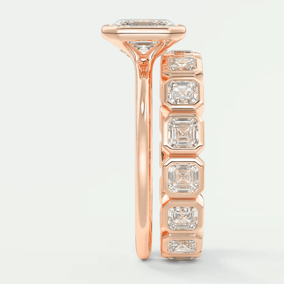 18k rose gold diamond engagement ring with a princess cut center stone and baguette side stones.
