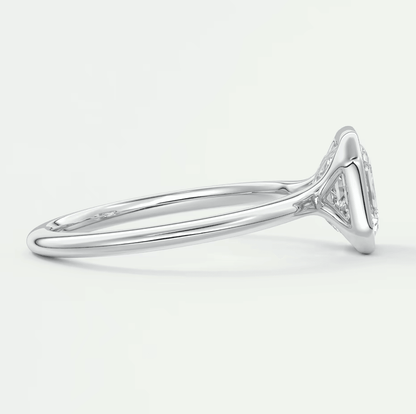 18k white gold diamond engagement ring with a marquise-cut center stone and delicate band.