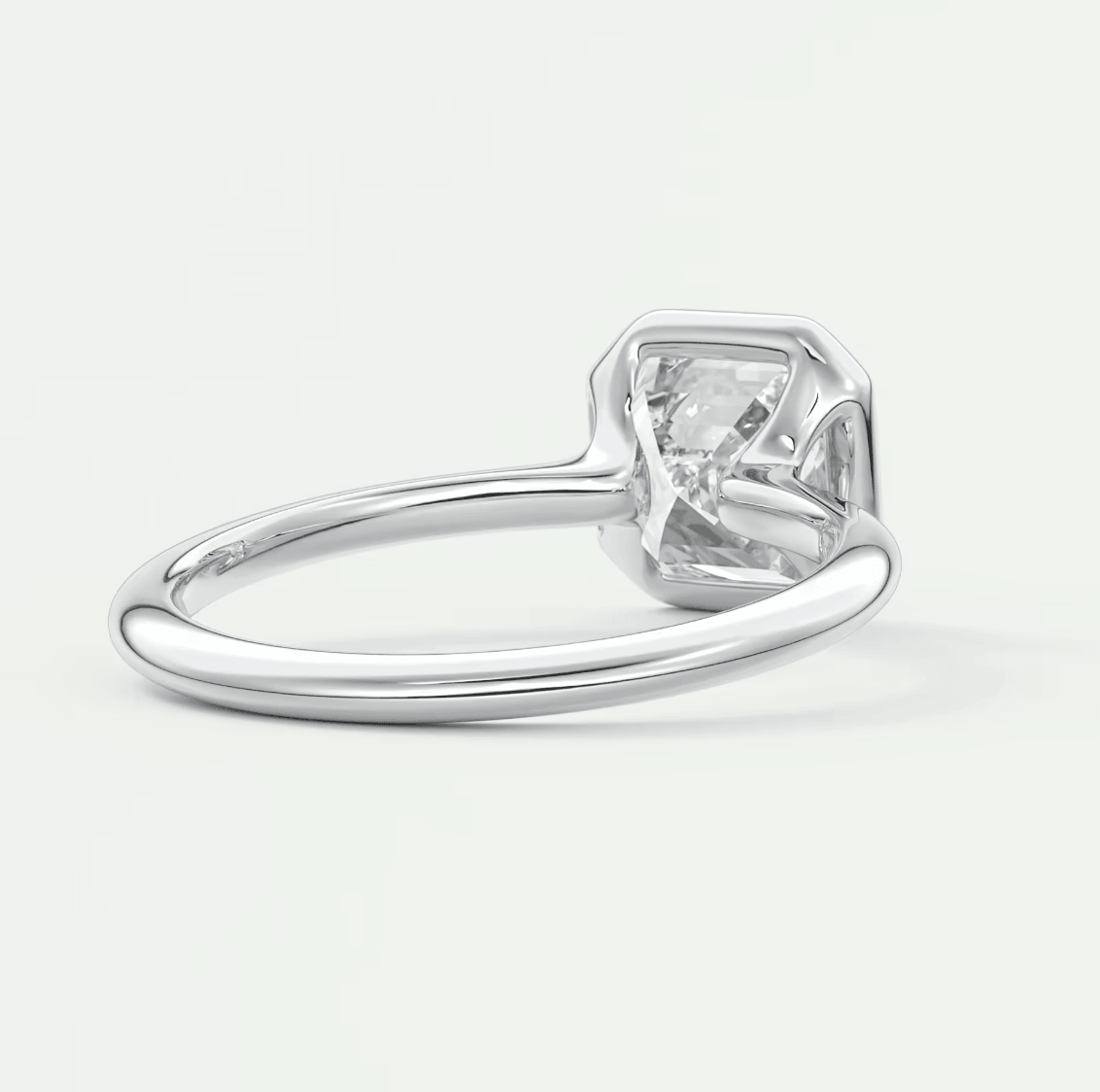 18-karat white gold solitaire engagement ring with a princess-cut diamond.