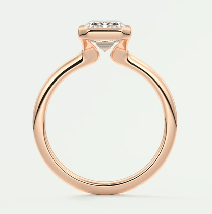 18-karat rose gold engagement ring with a princess-cut diamond.