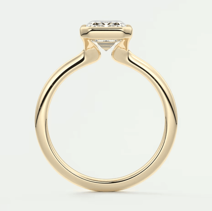 18k yellow gold engagement ring with a princess cut diamond.