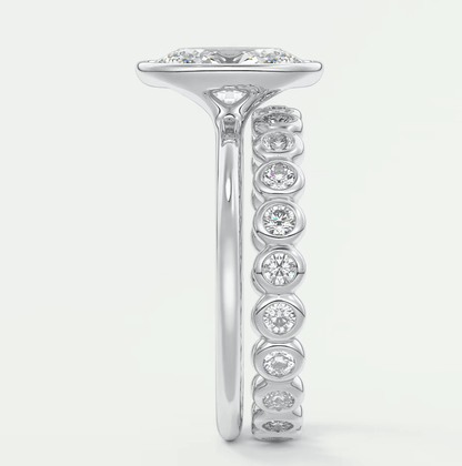 18k white gold diamond engagement ring with a princess cut center stone and channel set side stones.