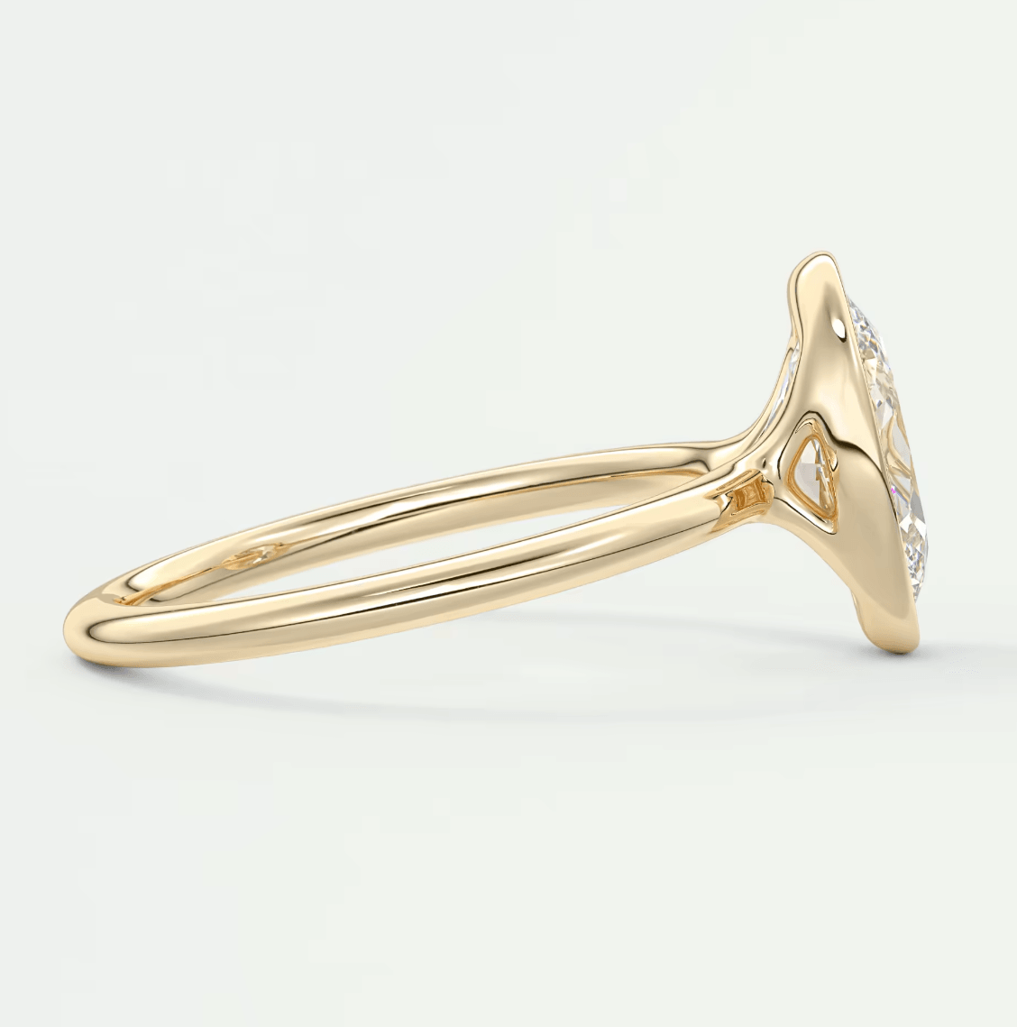 18k yellow gold diamond halo engagement ring with a marquise-cut center stone.