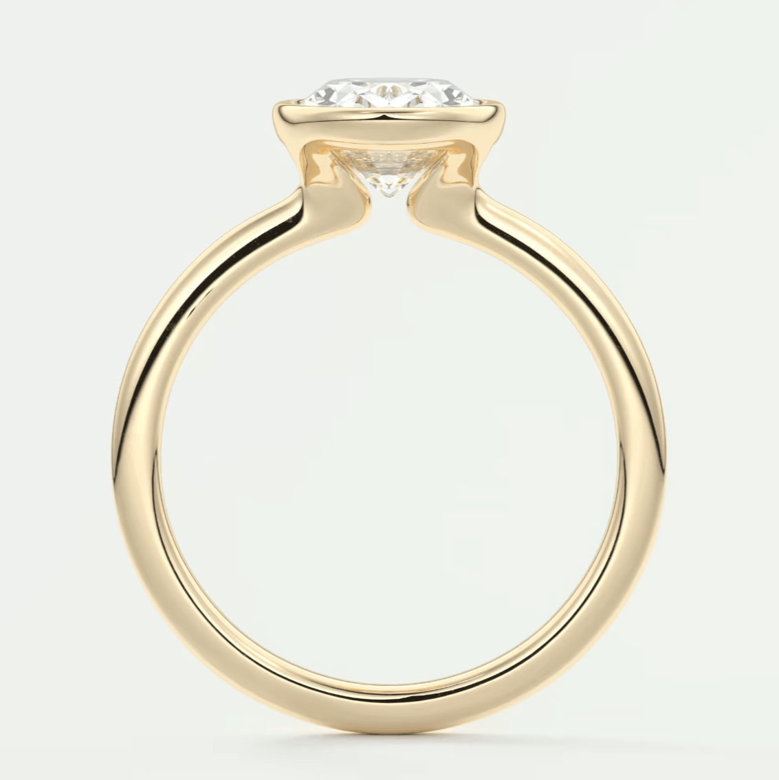 18-karat yellow gold engagement ring with a princess-cut diamond.