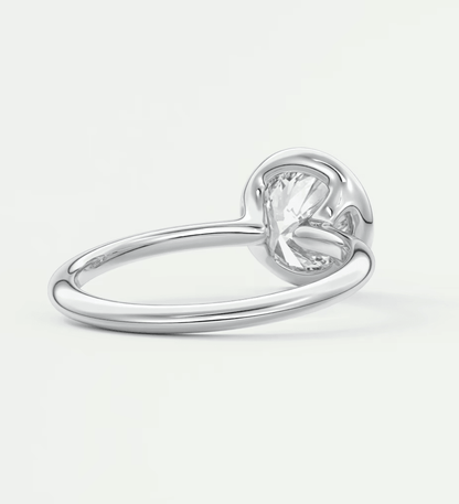 Silver heart-shaped ring with a clear gemstone