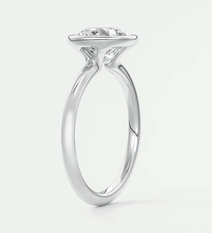 18-karat white gold engagement ring with a princess-cut diamond.