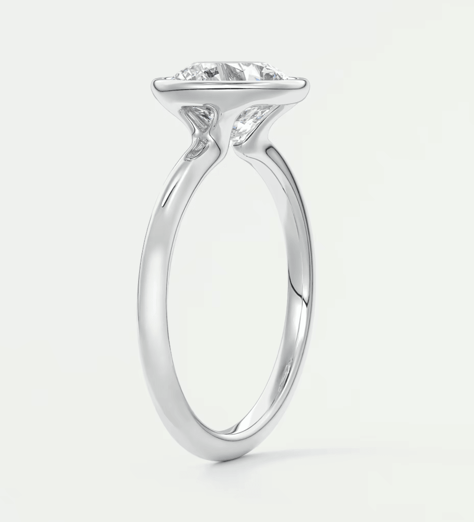 18-karat white gold engagement ring with a princess-cut diamond.