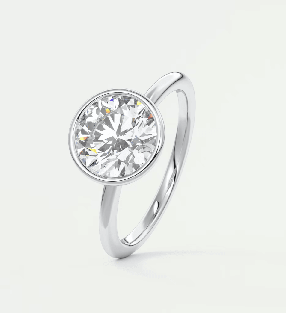 18-karat white gold solitaire diamond engagement ring.