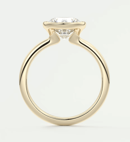 18-karat yellow gold engagement ring with a cushion-cut diamond.