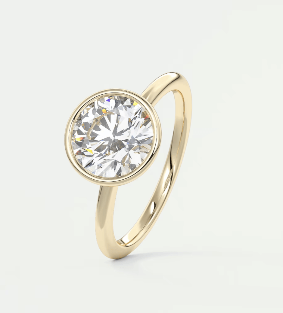 18-karat yellow gold solitaire diamond engagement ring.
