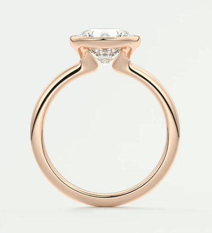 18k rose gold engagement ring with a round diamond.