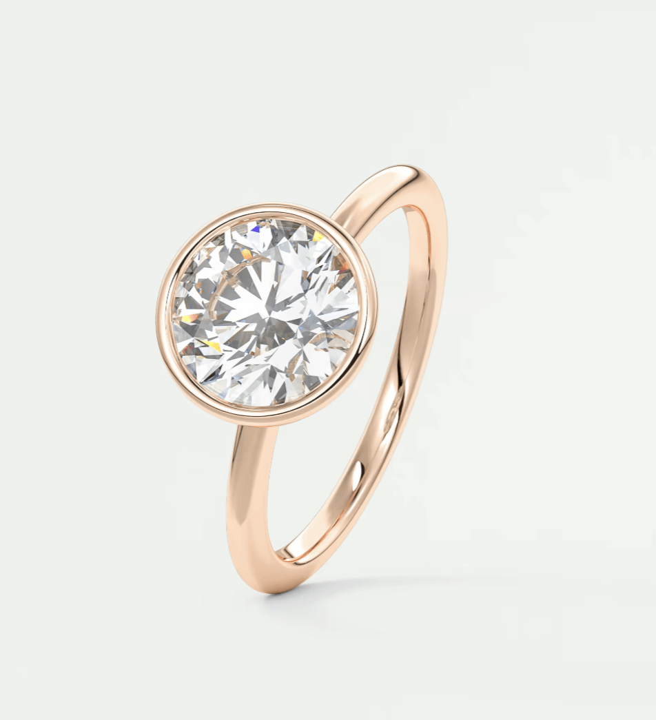 18-karat rose gold solitaire diamond engagement ring.