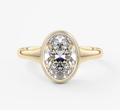 18-karat yellow gold oval diamond engagement ring.