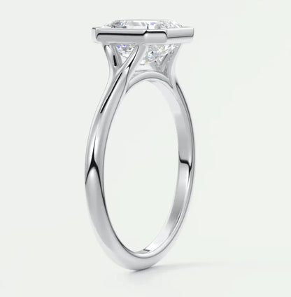 18k white gold princess cut diamond engagement ring with a solitaire design.