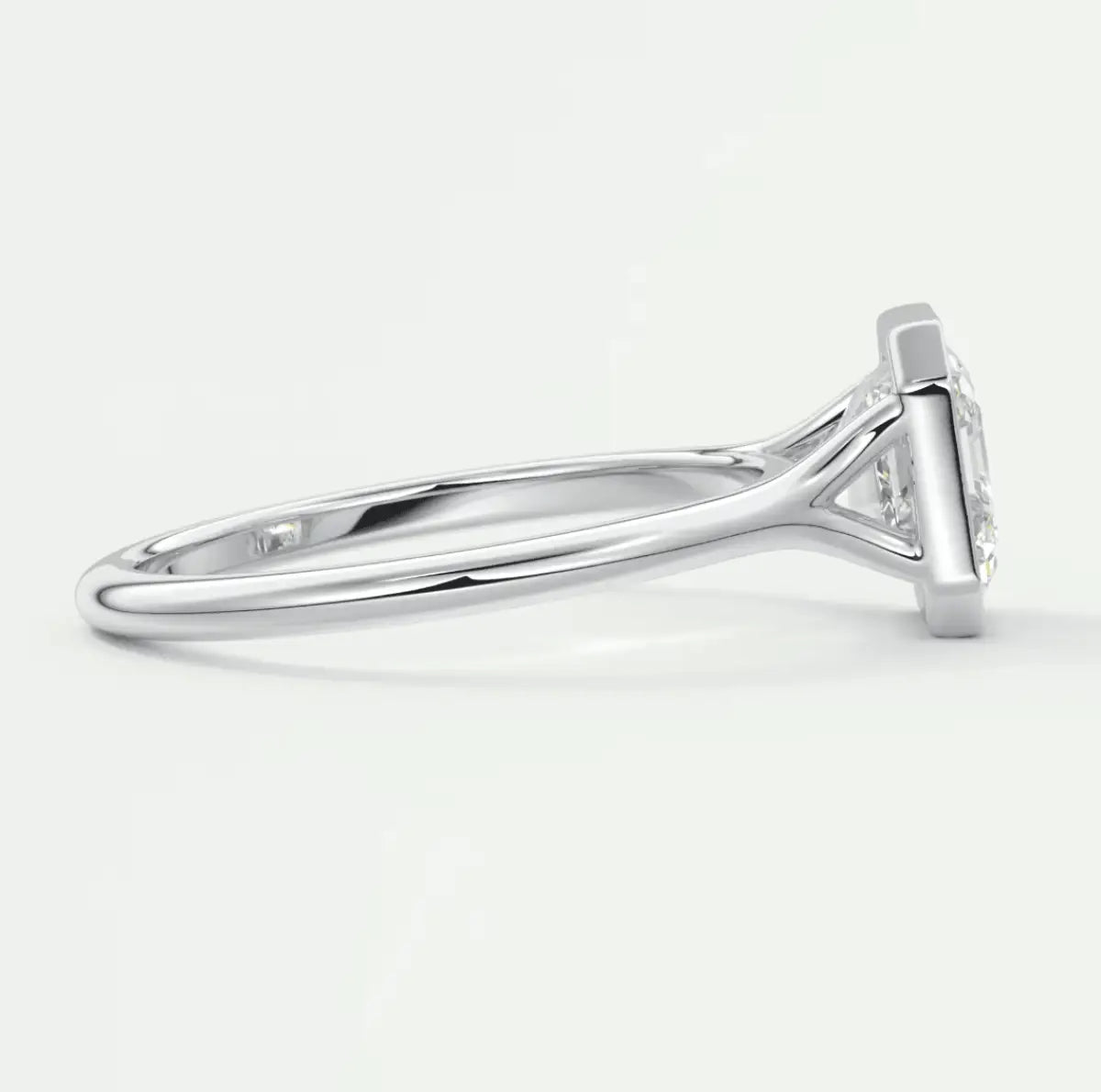 18k white gold diamond engagement ring with a cushion-cut center stone.