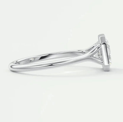 18k white gold diamond engagement ring with a cushion-cut center stone.