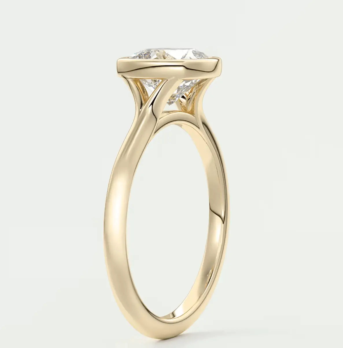 18-karat gold engagement ring with a cushion-cut diamond.