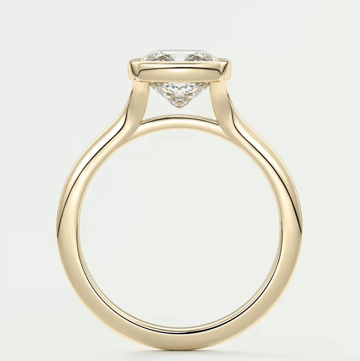 18-karat yellow gold engagement ring with a princess-cut diamond.