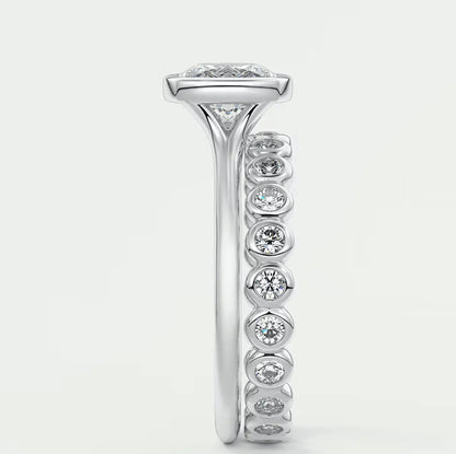 18k white gold diamond engagement ring with a princess cut center stone and channel set diamonds.
