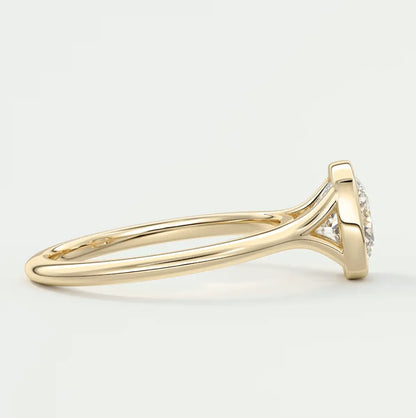 18k yellow gold diamond engagement ring with a halo design.