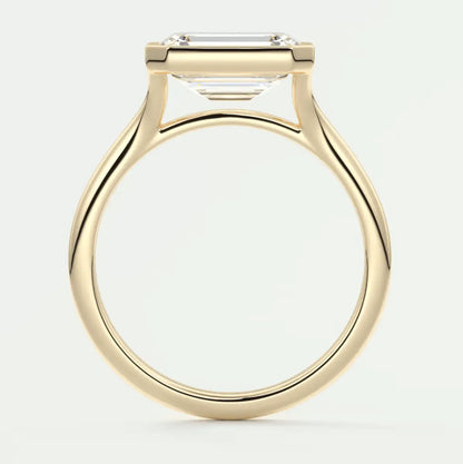 18k yellow gold emerald cut diamond engagement ring.