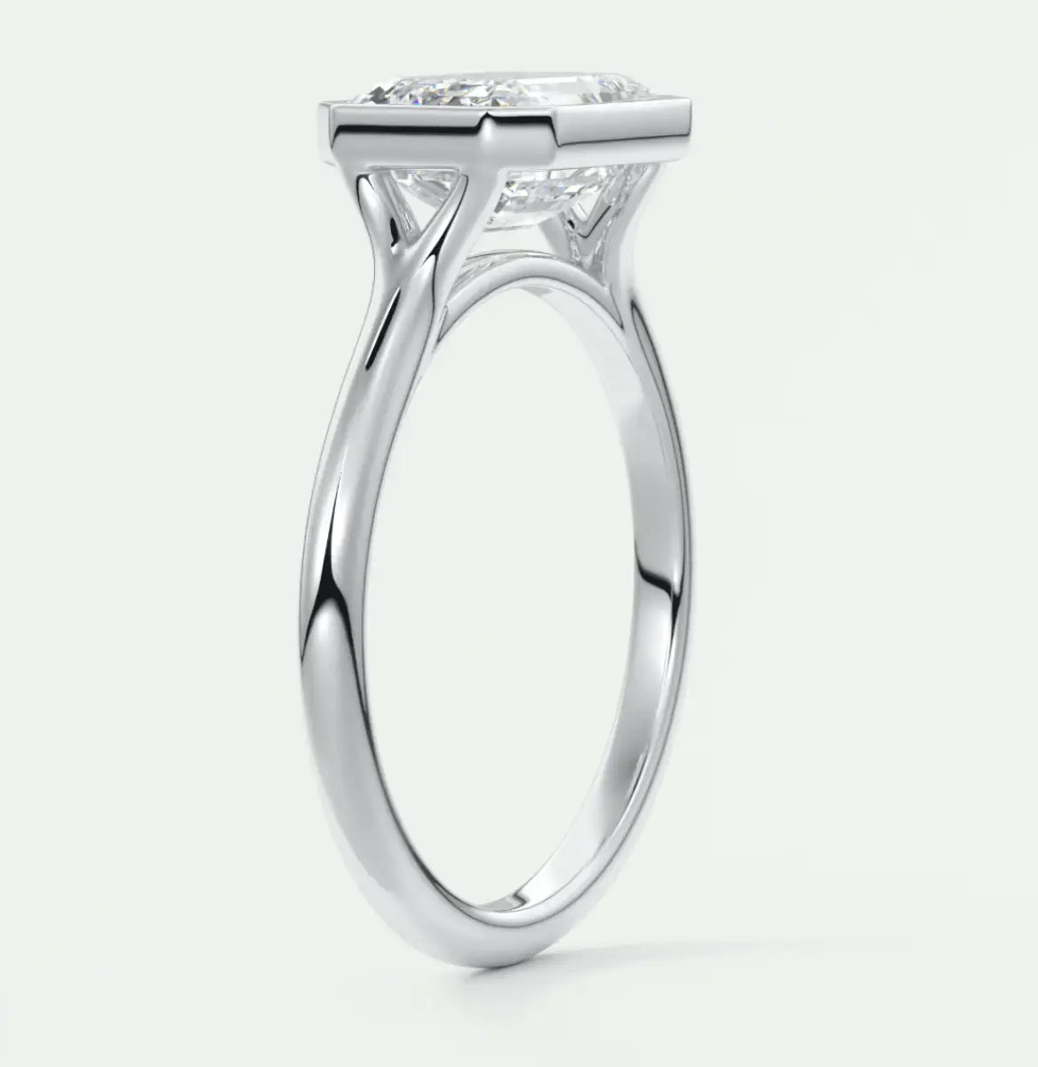 18-karat white gold engagement ring with a princess-cut diamond.
