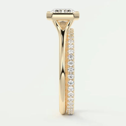 18k yellow gold engagement ring with a cushion-cut diamond and pave-set diamonds on the band.