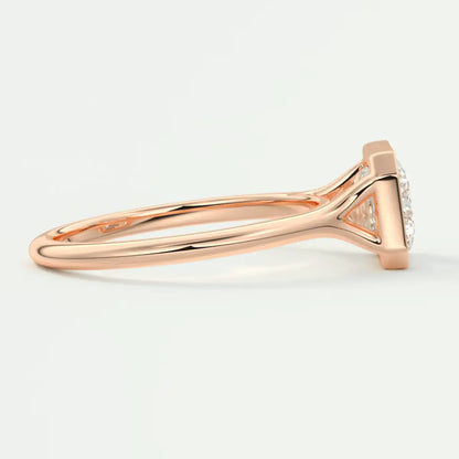 Rose gold diamond engagement ring with a cushion-cut center stone and halo of smaller diamonds.