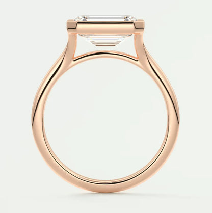 Rose gold engagement ring with emerald cut diamond