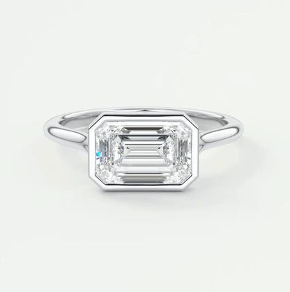 18k white gold emerald cut diamond engagement ring.