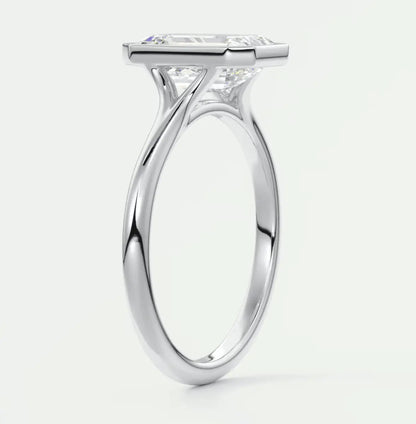 Princess cut diamond engagement ring with white gold band, featuring a cushion-shaped stone.