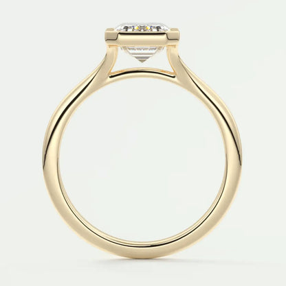 18-karat yellow gold engagement ring with a princess-cut diamond.