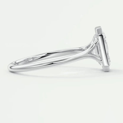 White gold diamond engagement ring with a princess cut center stone and side diamonds.