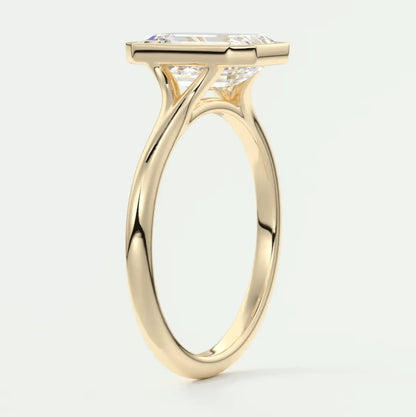 18k yellow gold engagement ring with a princess cut diamond.