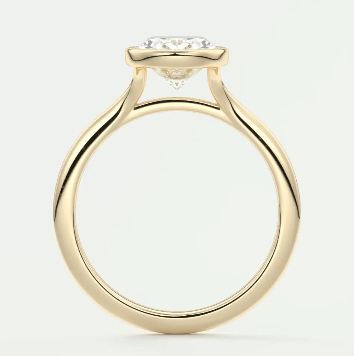 18k yellow gold engagement ring with a cushion-cut diamond.