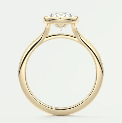 18k yellow gold engagement ring with a cushion-cut diamond.
