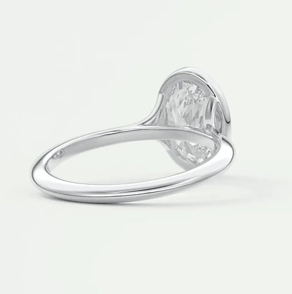 White diamond engagement ring with a heart-shaped band and prong setting.