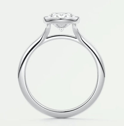 White gold diamond engagement ring with a halo design and prong setting.