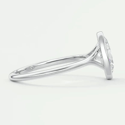 White gold diamond engagement ring with a round cut center stone and band adorned with small diamonds.